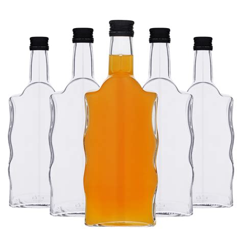 Üvegpalackok almaborral